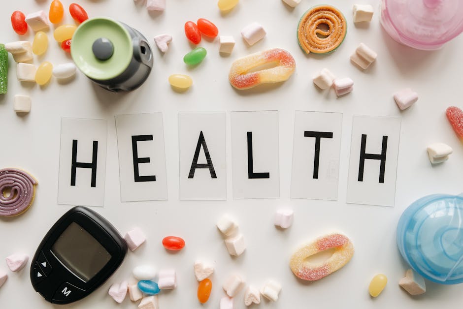 creative flat lay with sweets around a health text and monit