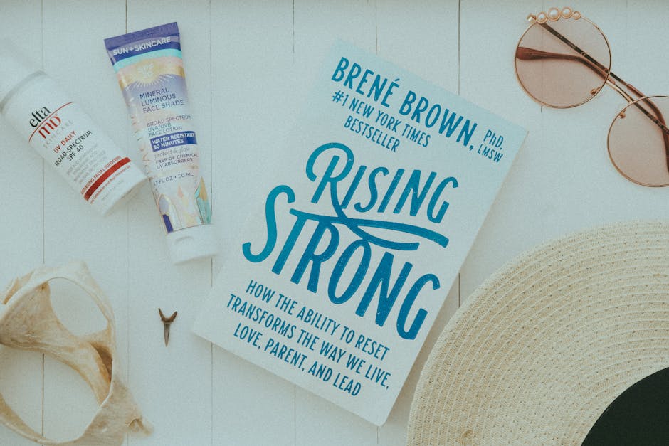 flat lay of summer essentials including rising strong book s