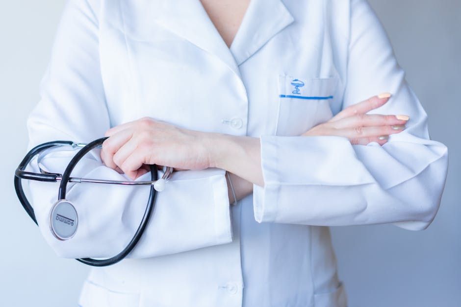 a close up image of a doctor in a white coat with a stethosc