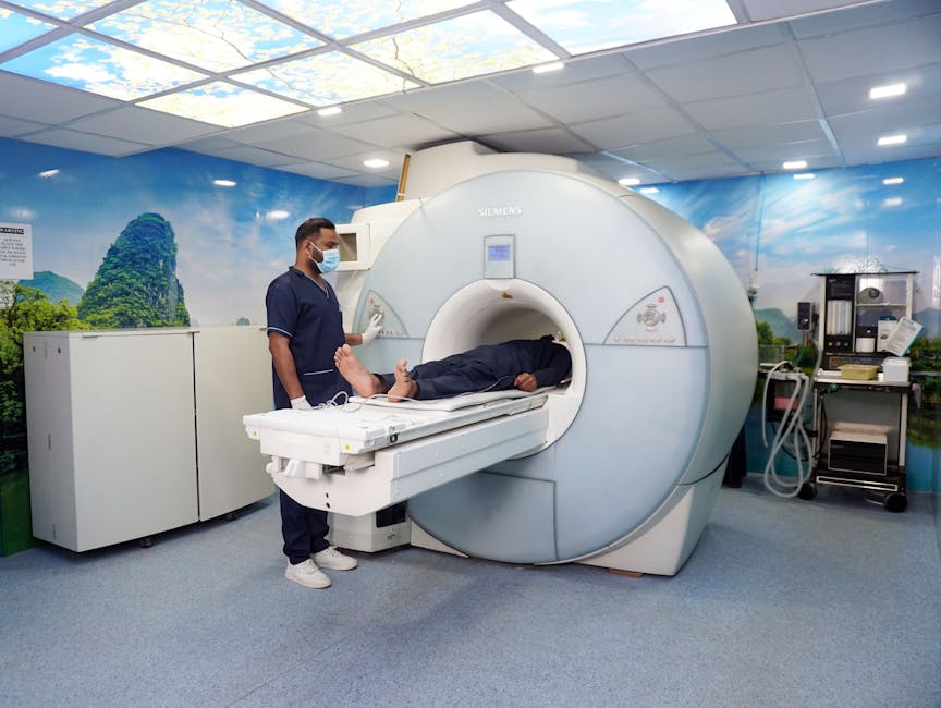 a medical technician assists a patient in an mri machine in