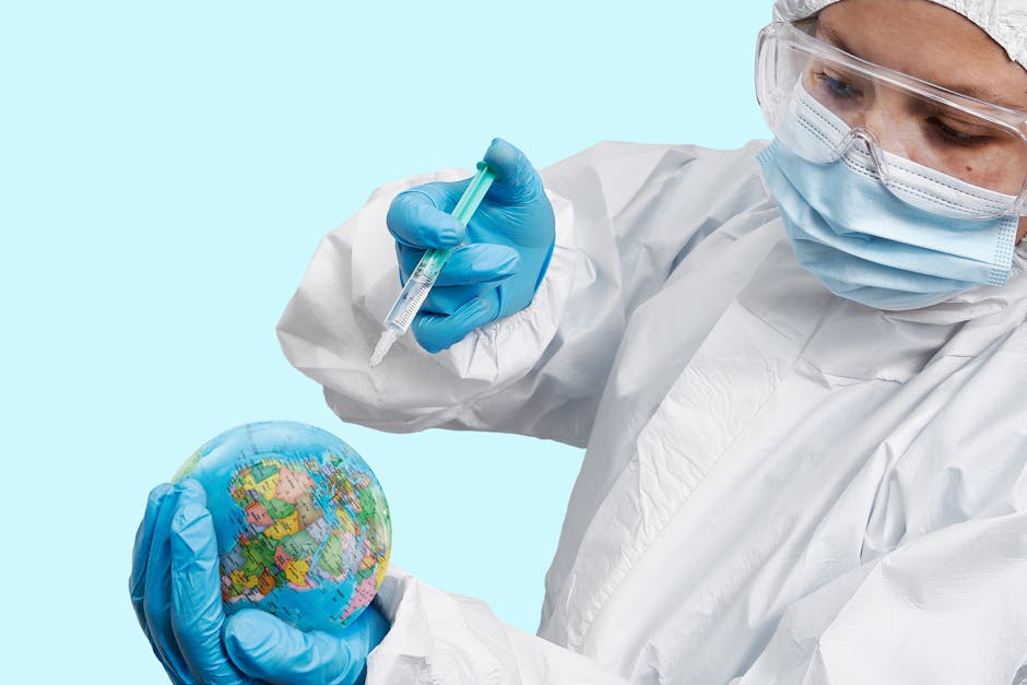 healthcare worker in ppe symbolically vaccinating the world